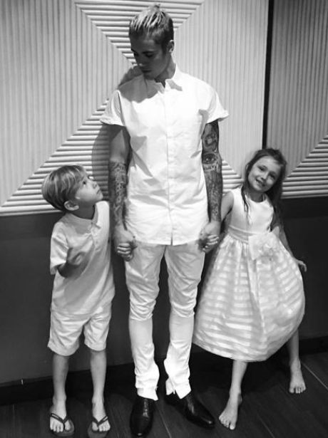 Justin Bieber takes a moment to thank his brother and sister for