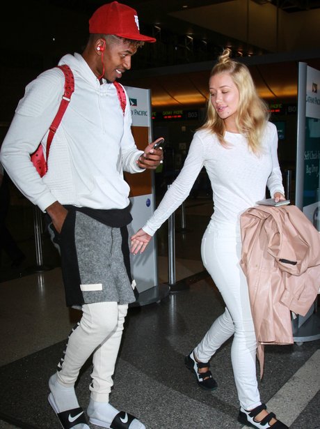 Iggy Azalea and her man Nick Young are keeping it VERY casual at LAX ...